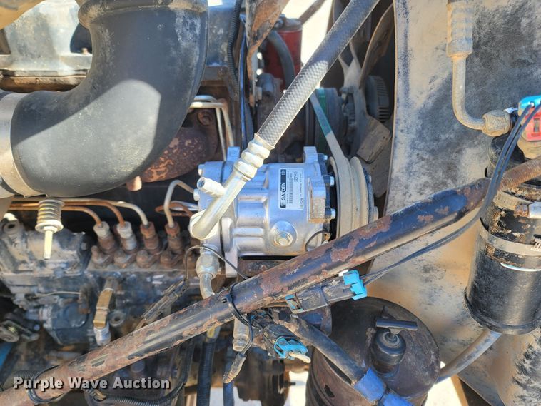 image for item MB9868 1997 Mack DM690S  roll-off container truck