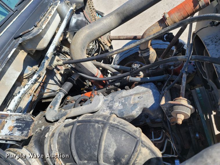 image for item MB9868 1997 Mack DM690S  roll-off container truck