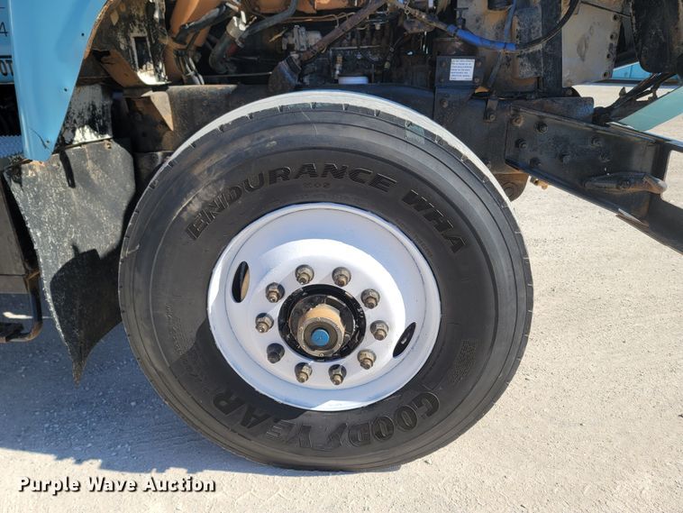 image for item MB9868 1997 Mack DM690S  roll-off container truck