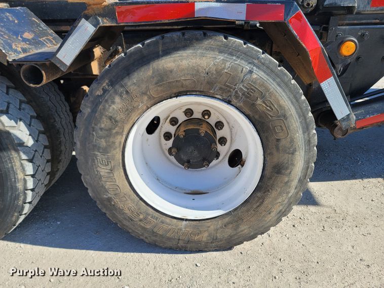 image for item MB9868 1997 Mack DM690S  roll-off container truck