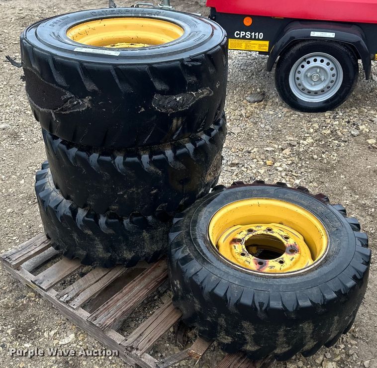image for item MP9193 (4) 12-16.5 NHS foam filled skid steer tires and wheels