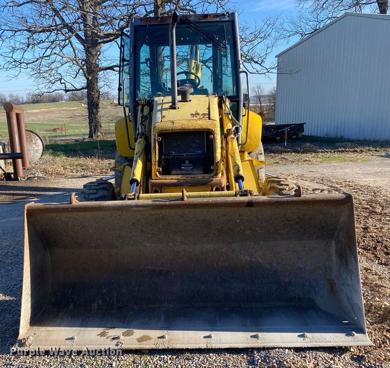 image for item DL7076 1999 New Holland 555E  backhoe