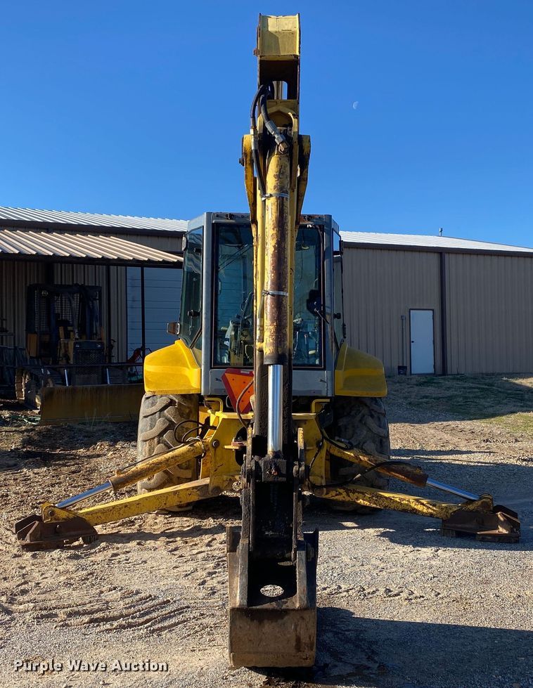 image for item DL7076 1999 New Holland 555E  backhoe