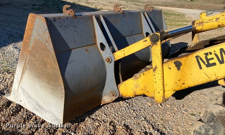 image for item DL7076 1999 New Holland 555E  backhoe