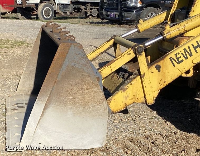 image for item DL7076 1999 New Holland 555E  backhoe