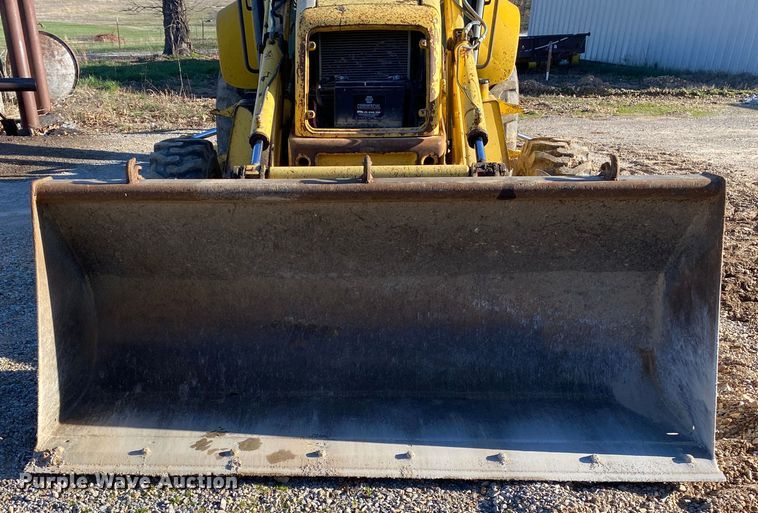 image for item DL7076 1999 New Holland 555E  backhoe