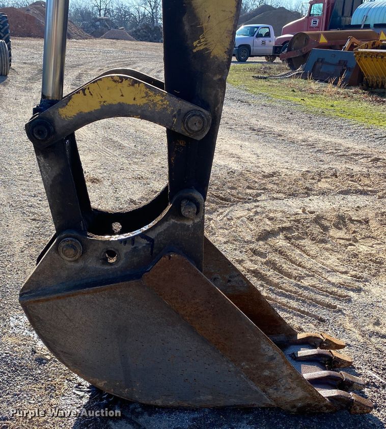 image for item DL7076 1999 New Holland 555E  backhoe