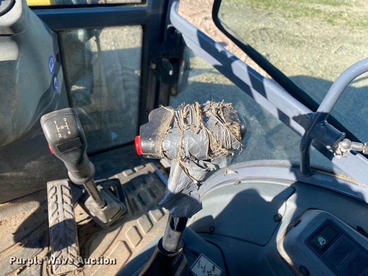 image for item DL7076 1999 New Holland 555E  backhoe