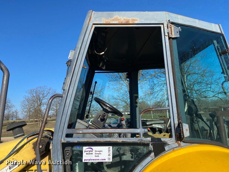 image for item DL7076 1999 New Holland 555E  backhoe