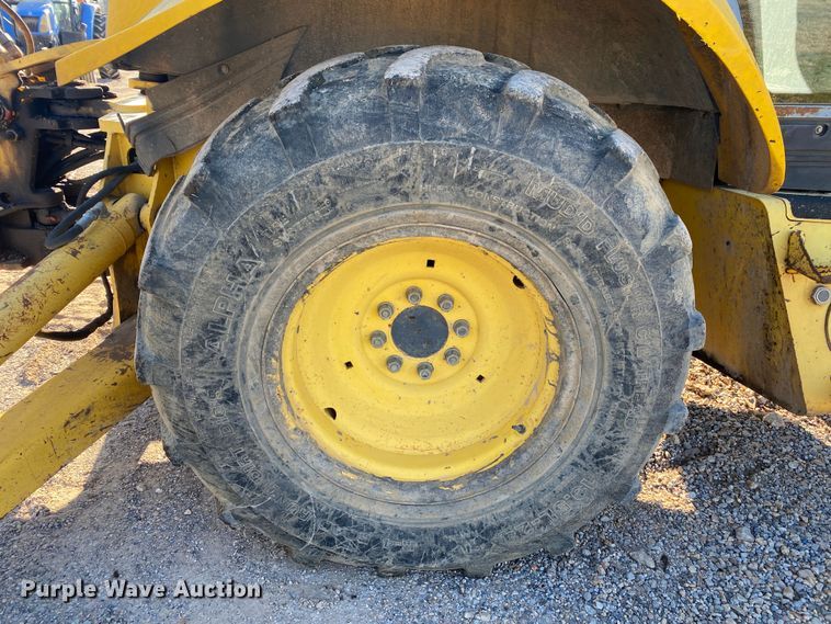 image for item DL7076 1999 New Holland 555E  backhoe