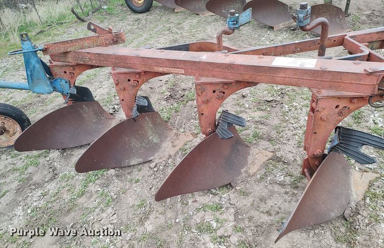 image for item DQ0375 McCormick  four bottom plow