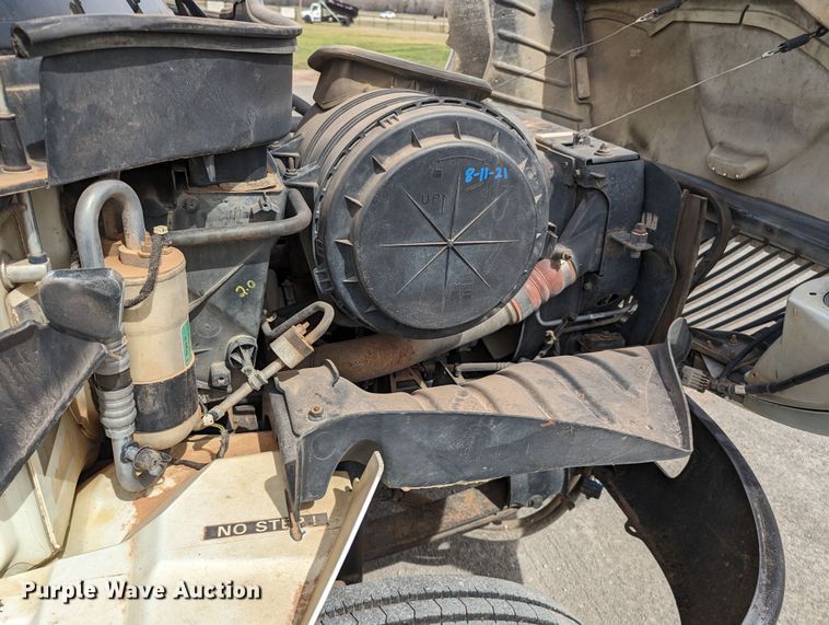 image for item MN9835 2003 International 4300  roll-off container truck