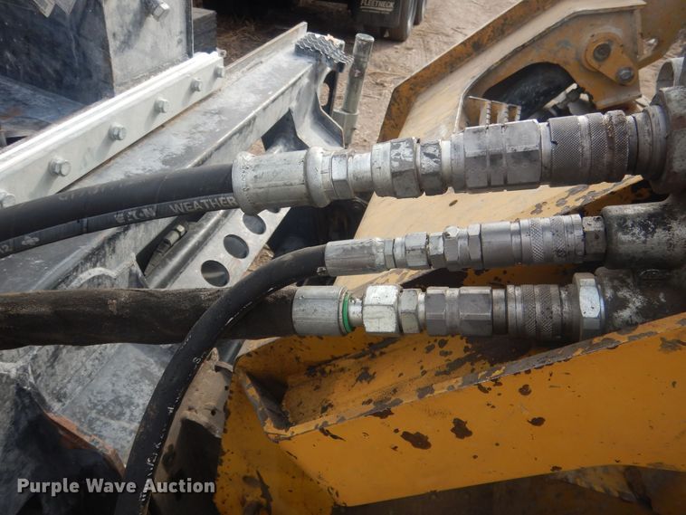 image for item DJ7017 Caterpillar SW345B-80  skid steer rock saw