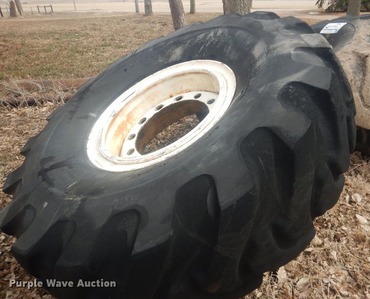 image for item DJ7022 (4) Toyo 16.00-24 tires and wheels