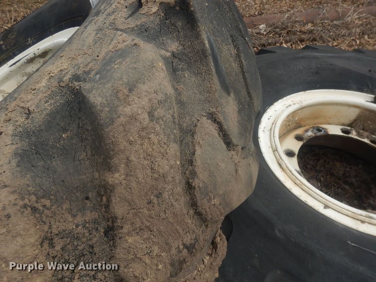 image for item DJ7022 (4) Toyo 16.00-24 tires and wheels