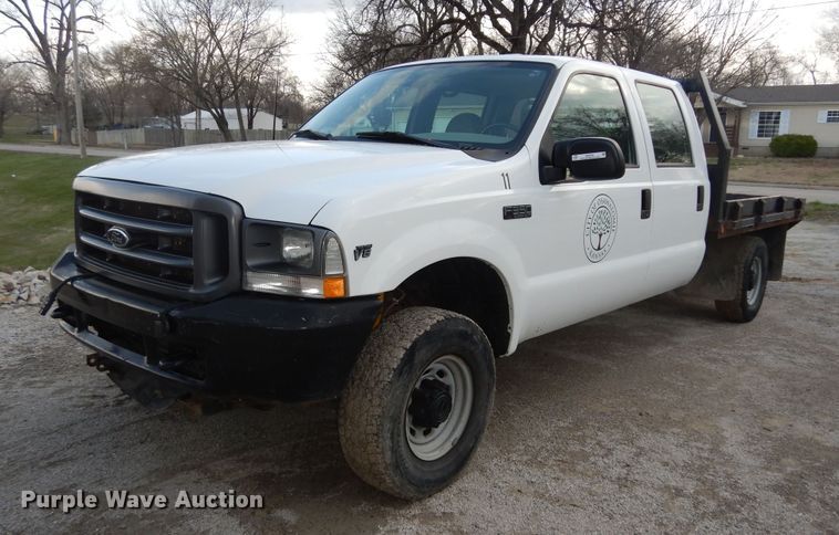 image for item MI9352 2002 Ford F350 Super Duty XL  Crew Cab flatbed pickup truck