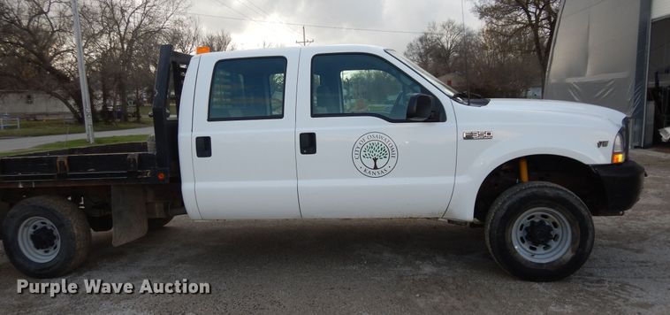 image for item MI9352 2002 Ford F350 Super Duty XL  Crew Cab flatbed pickup truck