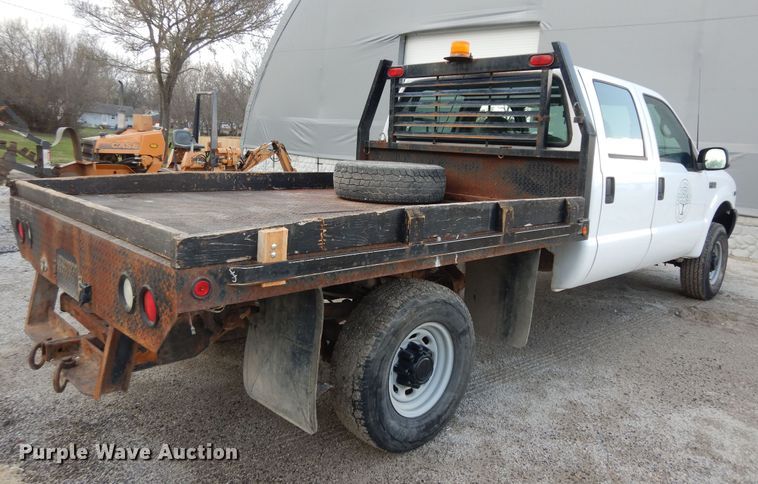 image for item MI9352 2002 Ford F350 Super Duty XL  Crew Cab flatbed pickup truck
