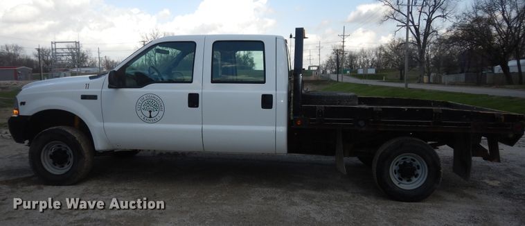 image for item MI9352 2002 Ford F350 Super Duty XL  Crew Cab flatbed pickup truck