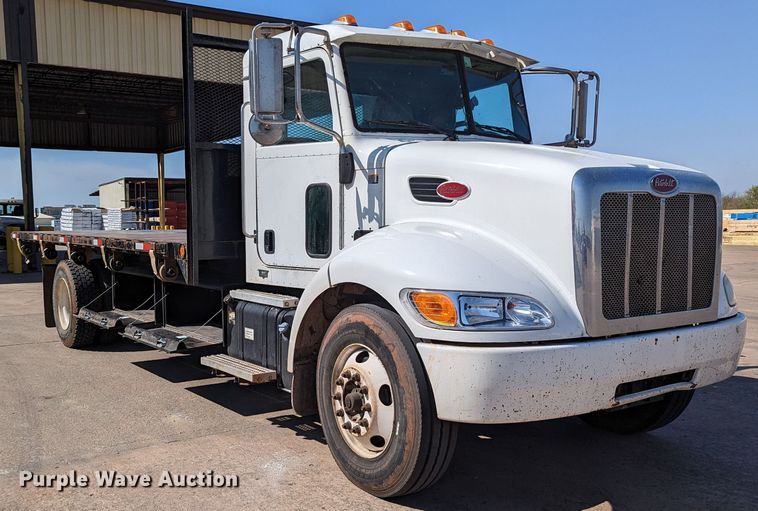 image for item MN9874 2014 Peterbilt 330  dump flatbed truck