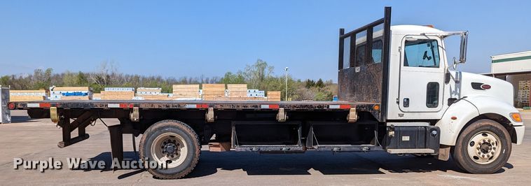 image for item MN9874 2014 Peterbilt 330  dump flatbed truck