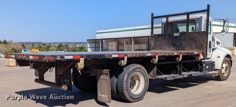 image for item MN9874 2014 Peterbilt 330  dump flatbed truck