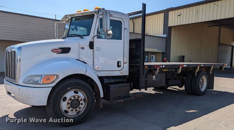 image for item MN9874 2014 Peterbilt 330  dump flatbed truck