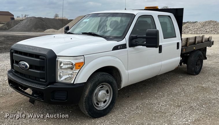 image for item LA9899 2011 Ford F250 Super Duty  Crew Cab flatbed pickup truck