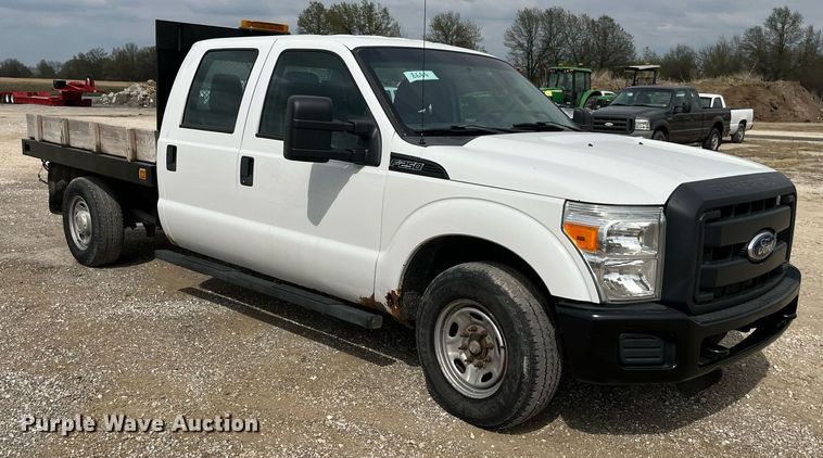 image for item LA9899 2011 Ford F250 Super Duty  Crew Cab flatbed pickup truck