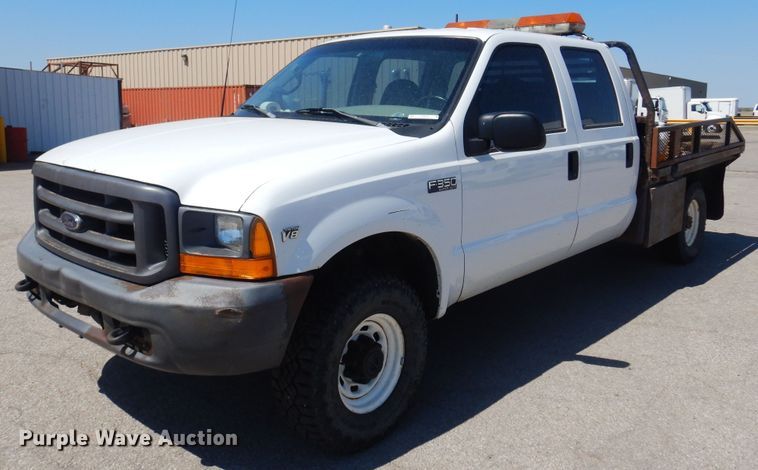 image for item LT9616 2000  Ford F350 Super Duty  Crew Cab flatbed pickup truck