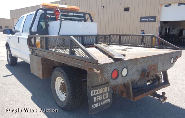 image for item LT9616 2000  Ford F350 Super Duty  Crew Cab flatbed pickup truck