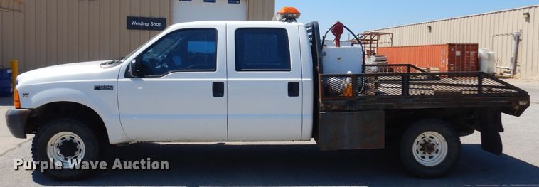 image for item LT9616 2000  Ford F350 Super Duty  Crew Cab flatbed pickup truck