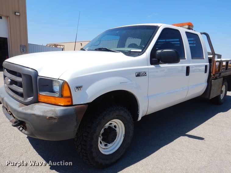 image for item LT9616 2000  Ford F350 Super Duty  Crew Cab flatbed pickup truck