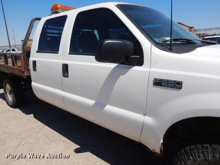 image for item LT9616 2000  Ford F350 Super Duty  Crew Cab flatbed pickup truck