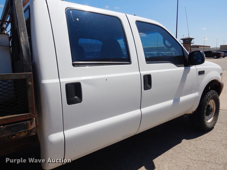 image for item LT9616 2000  Ford F350 Super Duty  Crew Cab flatbed pickup truck