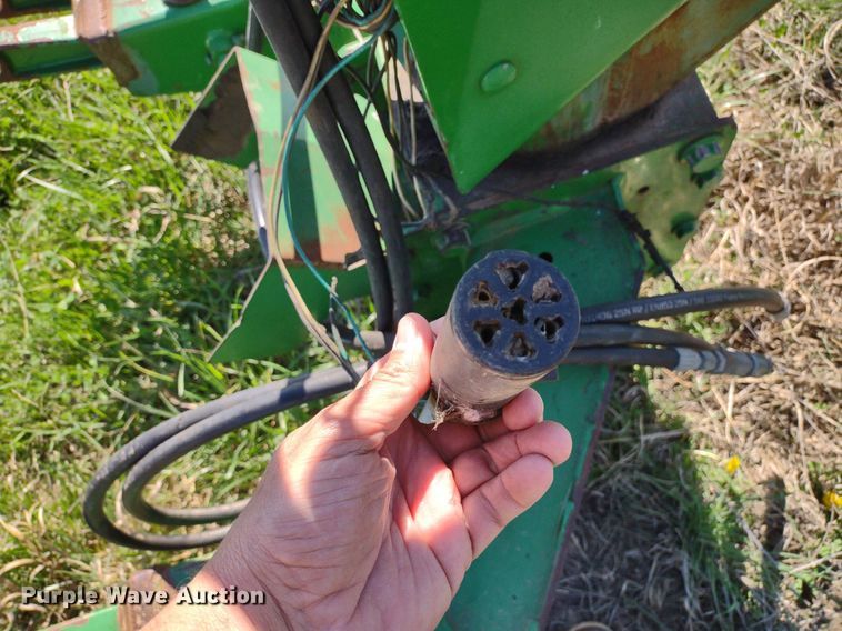 image for item DQ1672 2000 John Deere 945  swather / windrower