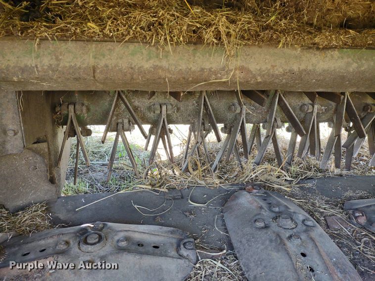 image for item DQ1672 2000 John Deere 945  swather / windrower