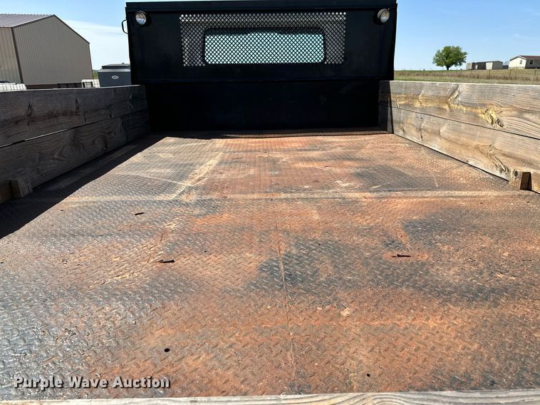 image for item LR9722 1999 International 4700  dump flatbed truck