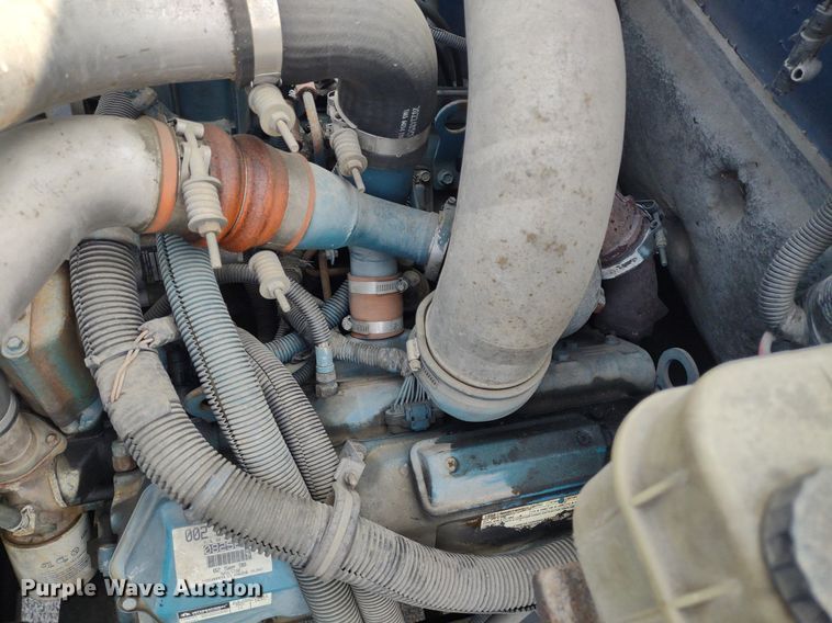 image for item DQ1715 1999 International 4700  dump flatbed truck