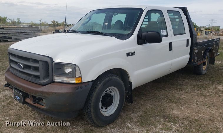 image for item DQ0571 2003 Ford F350 Super Duty  Crew Cab flatbed pickup truck