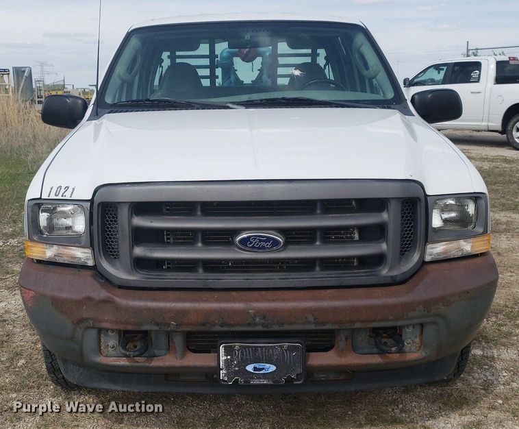 image for item DQ0571 2003 Ford F350 Super Duty  Crew Cab flatbed pickup truck