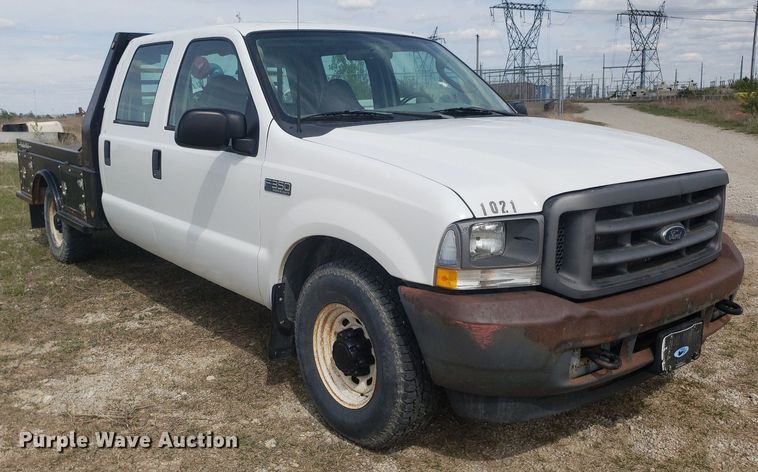 image for item DQ0571 2003 Ford F350 Super Duty  Crew Cab flatbed pickup truck