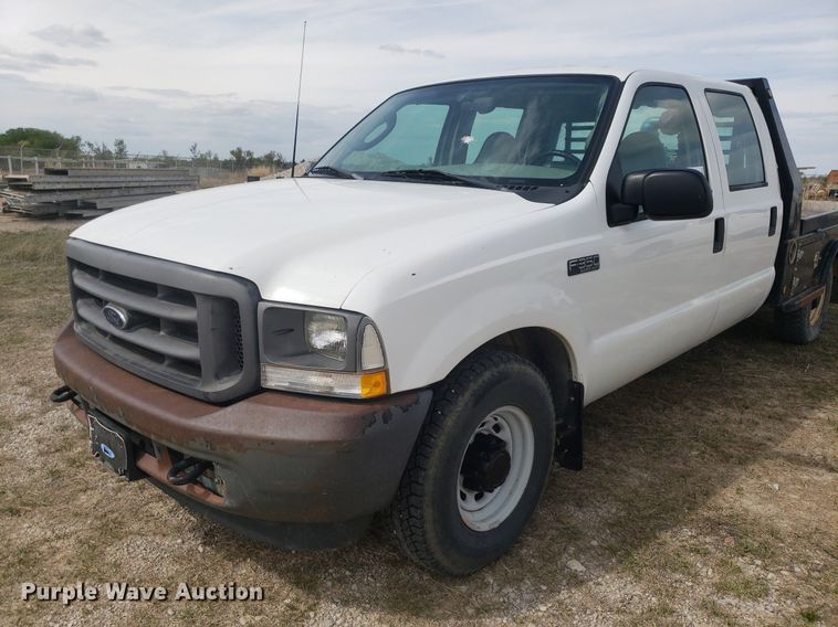 image for item DQ0571 2003 Ford F350 Super Duty  Crew Cab flatbed pickup truck