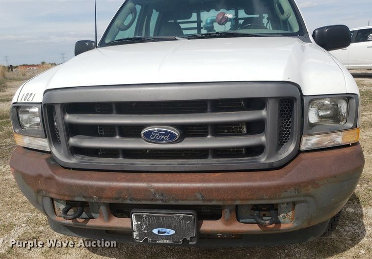 image for item DQ0571 2003 Ford F350 Super Duty  Crew Cab flatbed pickup truck