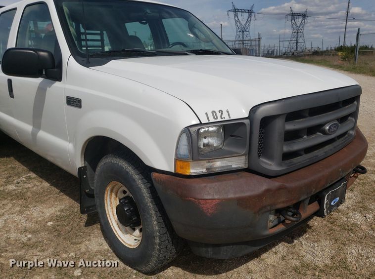 image for item DQ0571 2003 Ford F350 Super Duty  Crew Cab flatbed pickup truck
