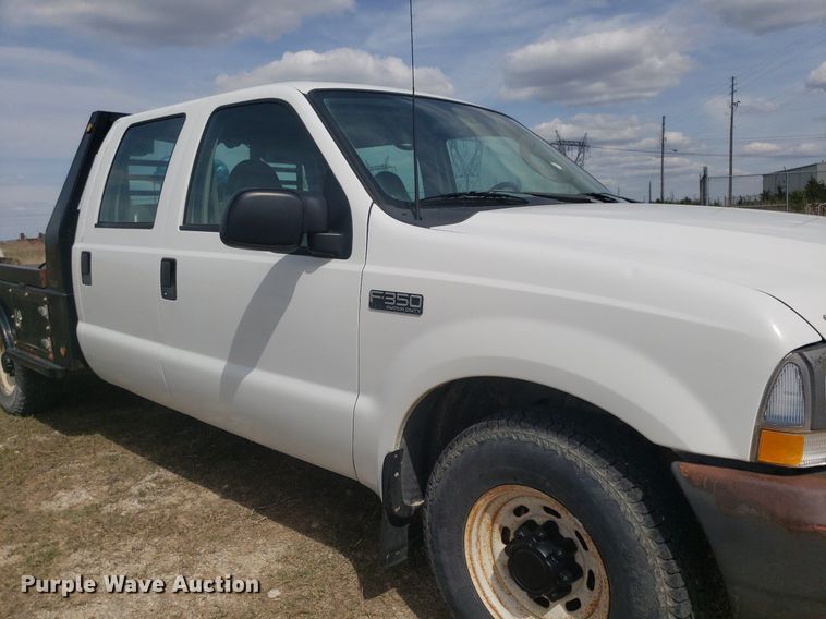 image for item DQ0571 2003 Ford F350 Super Duty  Crew Cab flatbed pickup truck