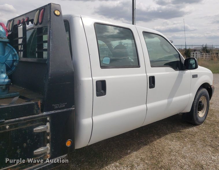 image for item DQ0571 2003 Ford F350 Super Duty  Crew Cab flatbed pickup truck