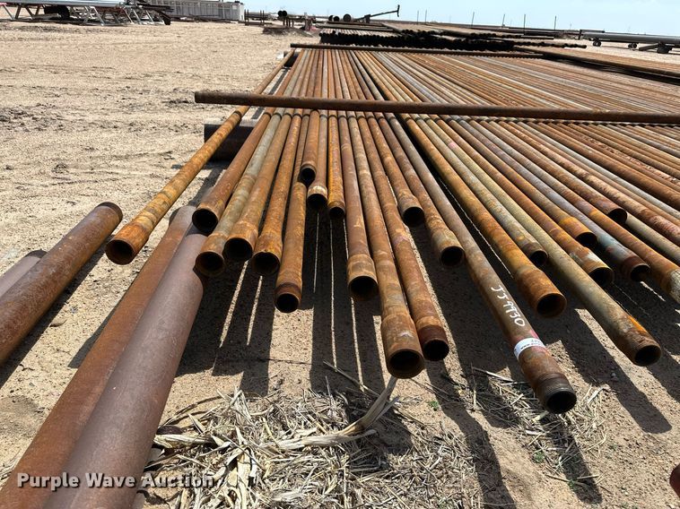 image for item JJ9930 Approximately 100 joints of 2 3/8" diameter pipe