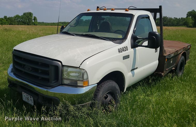 image for item DC6064 2002 Ford F350 Super Duty XL  flatbed pickup truck