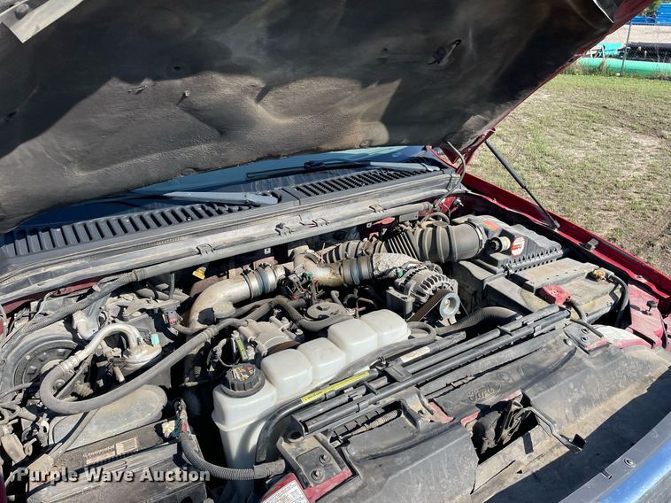 image for item LY9607 2000 Ford F450 Super Duty  Crew Cab flatbed pickup truck